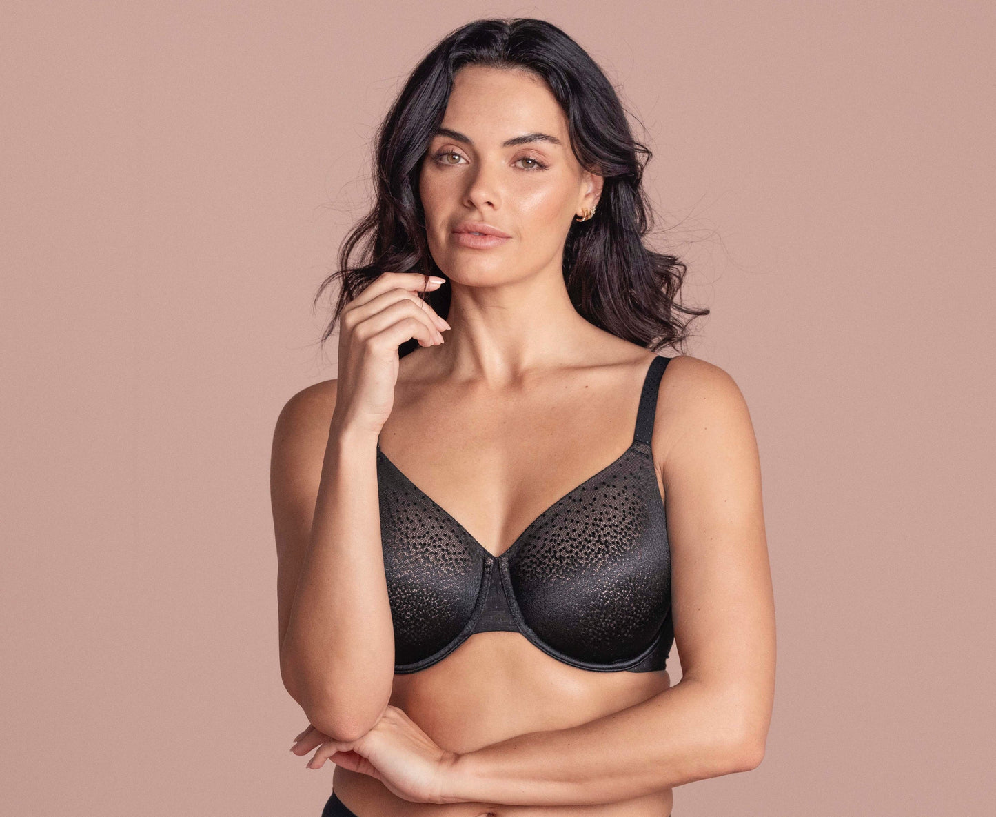 woman wearing a black underwired t-shirt bra with shiny dots