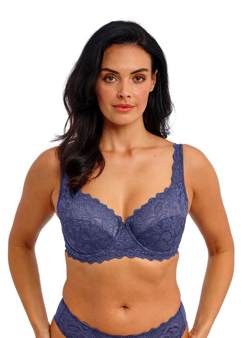 woman wearing a denim blue lace bra