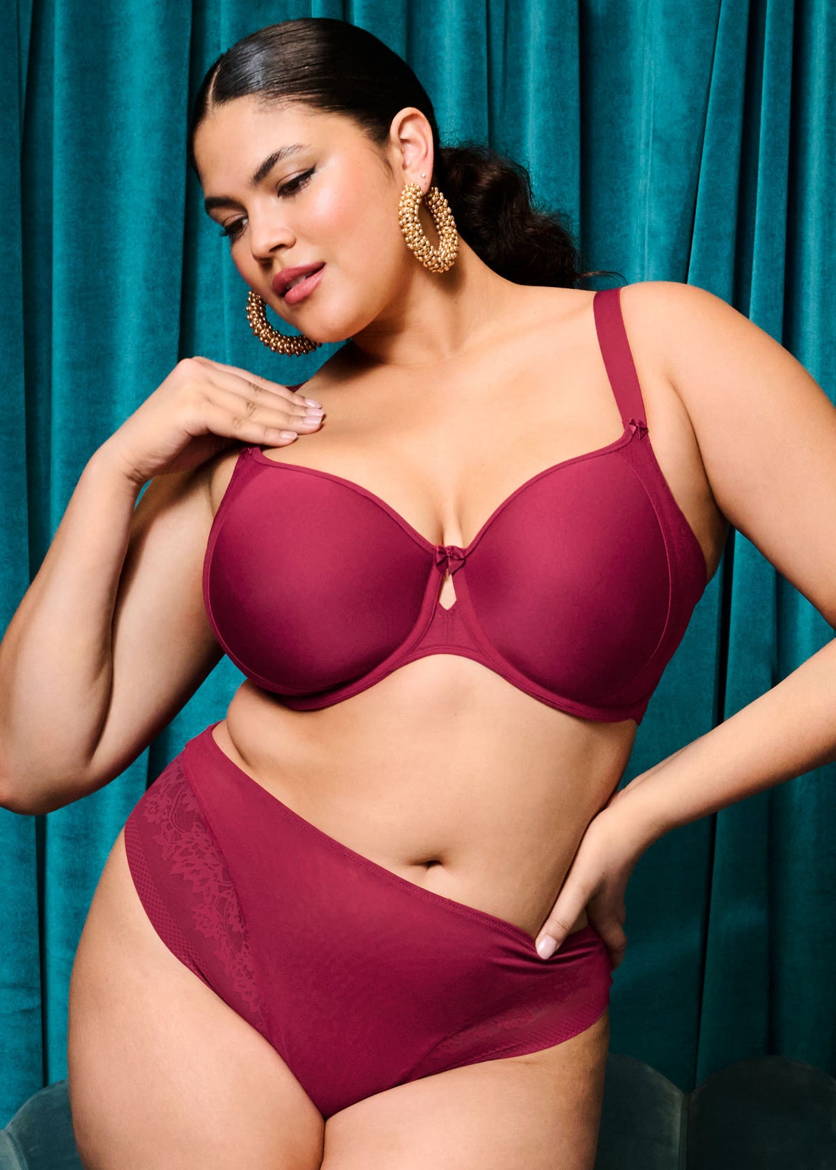 curvy woman wearing a wine red big cup moulded spacer bra with matching brief