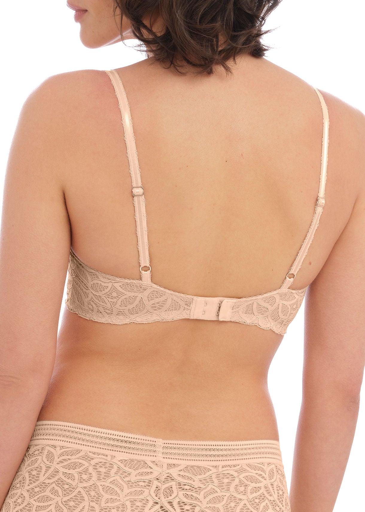 woman wearing a lace push up bra in nude color