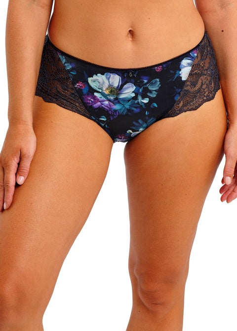 woman wearing a short in midnight blue color with flowerprint and stretch lace