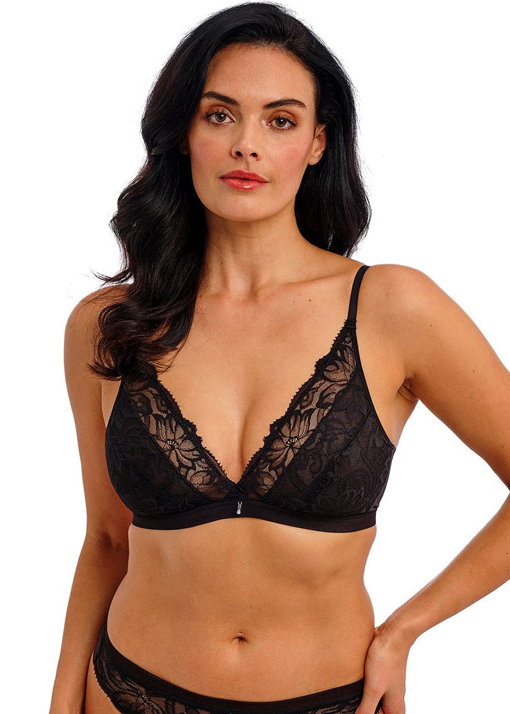 woman wearing black lace bralette and briefs