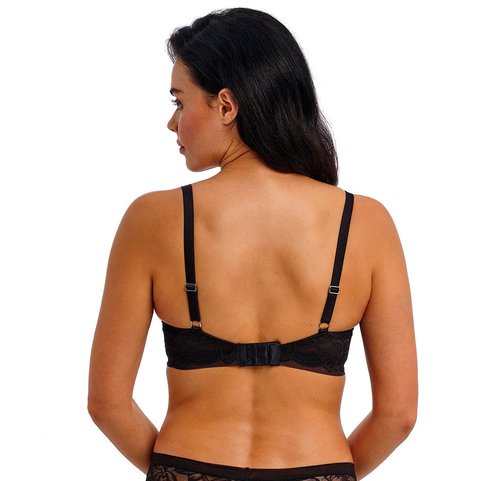 woman wearing a black lace push up bra