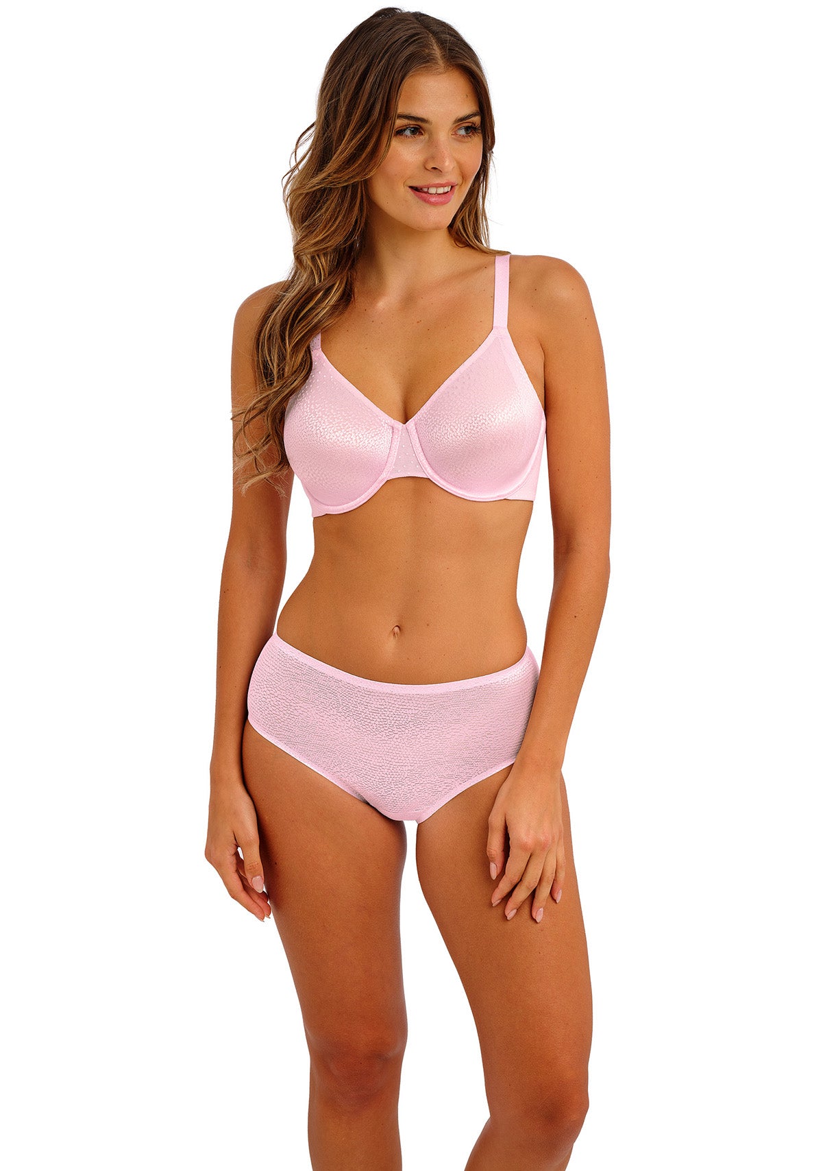 woman wearing a smooth t-shirt bra in a bright pink color with shiny dots