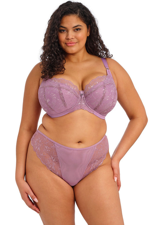 curvy woman wearing a padded big cup plunge bra in heather purple against a white background