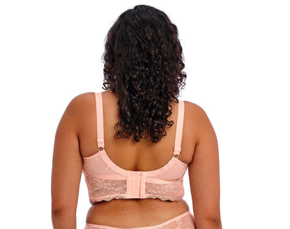 curvy woman wearing a Big cups pink lace bralette with embroidered flowers 