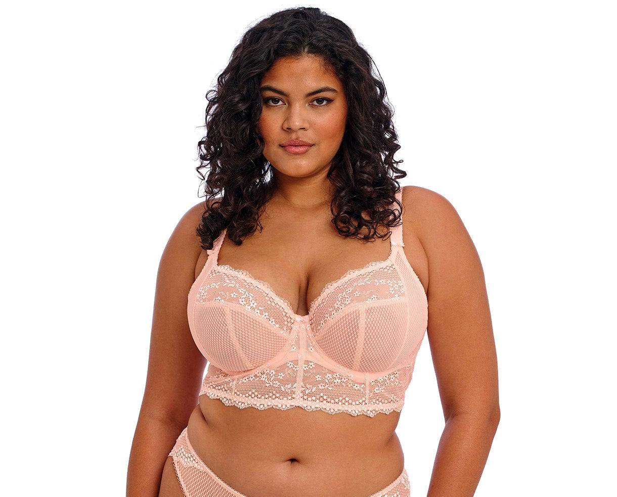 curvy woman wearing a Big cups pink lace bralette with embroidered flowers 