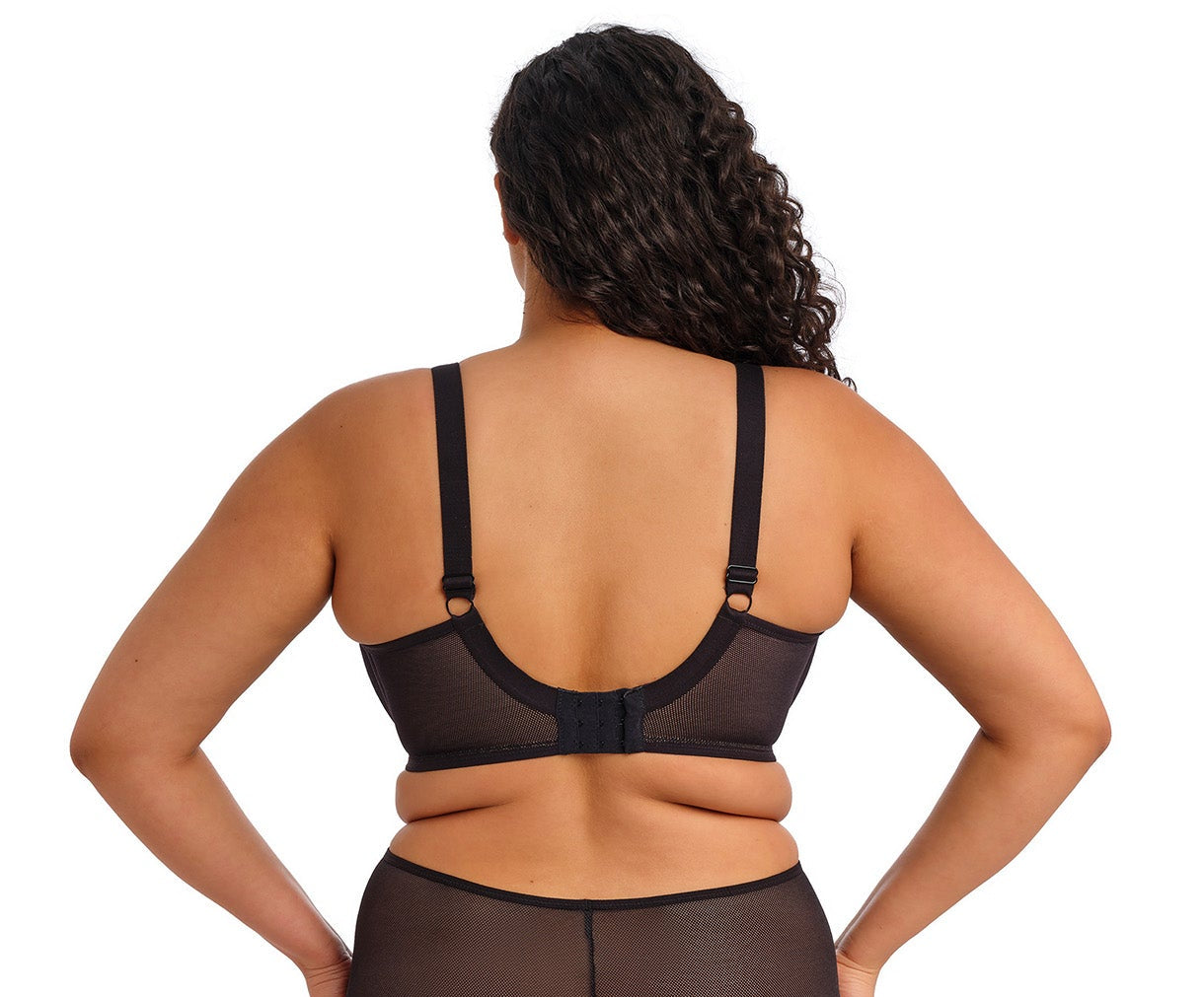 curvy woman wearing a black big cup bra in mesh