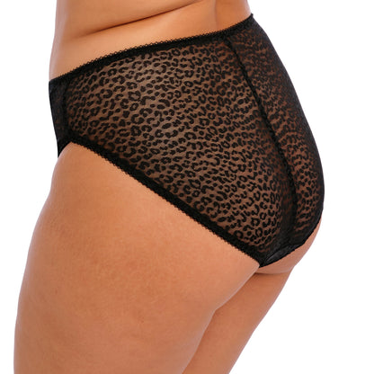 curvy woman wearing Black lace underwear with leopard print trim on a white background