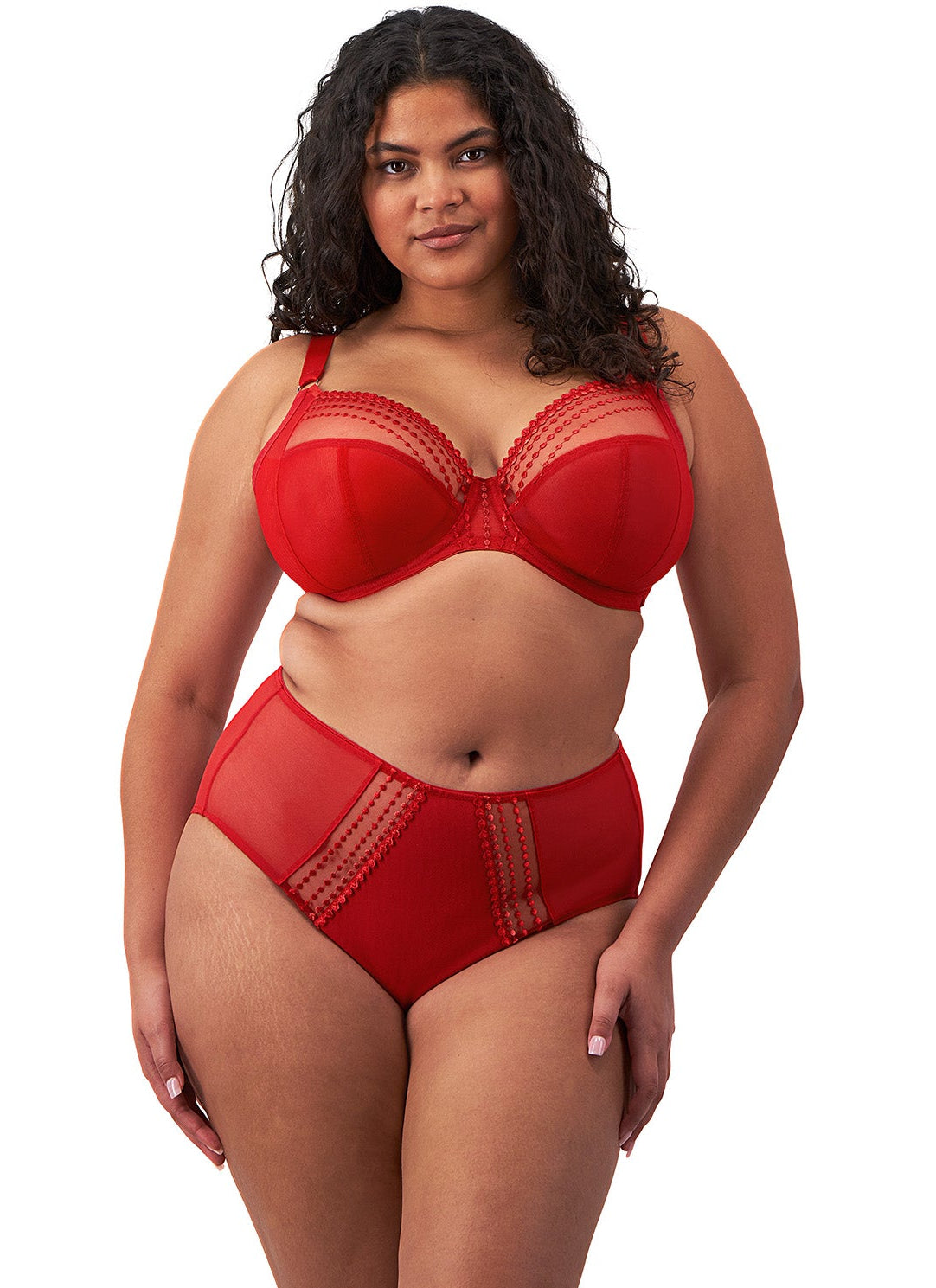 curvy woman wearing a plussize bra with mesh panels in red color against a white background