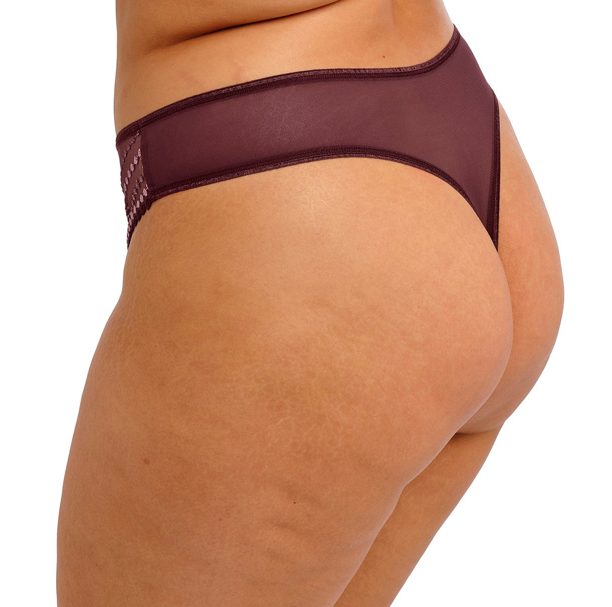 curvy woman wearing a purple lingerie bottom with lace trim on a white background