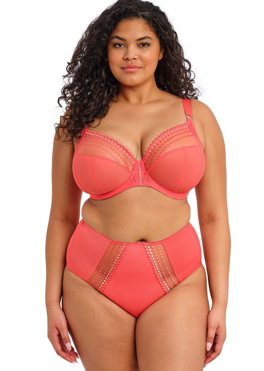 curvy woman wearing a sunset color lingerie set on a white background