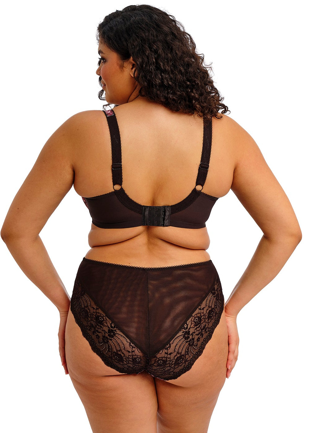 curvy woman wearing a lingerie set with dark floral print