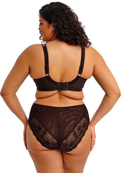 curvy woman wearing a lingerie set with dark floral print