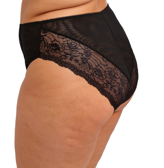 curvy woman wearing a black plussize high waist brief with mesh lace panels and printed colorfull flowers