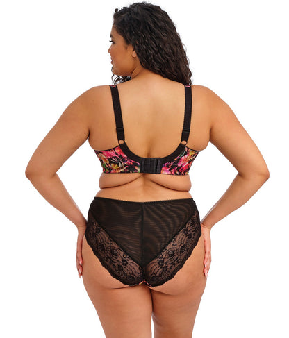 curvy woman wearing a black plussize high waist brief with mesh lace panels and printed colorfull flowers