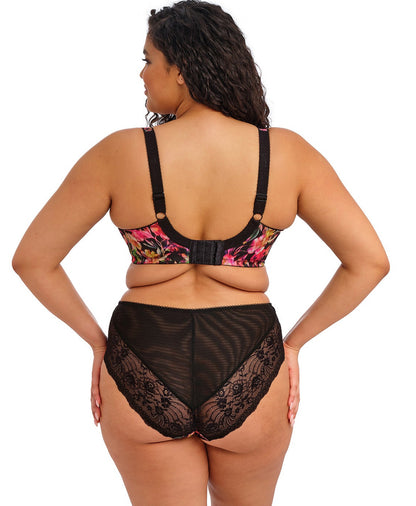 curvy woman wearing a plussize bra in black with colourfull printed flowers and stretch lace  and matching briefs