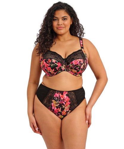 curvy woman wearing a black plussize high waist brief with mesh lace panels and printed colorfull flowers