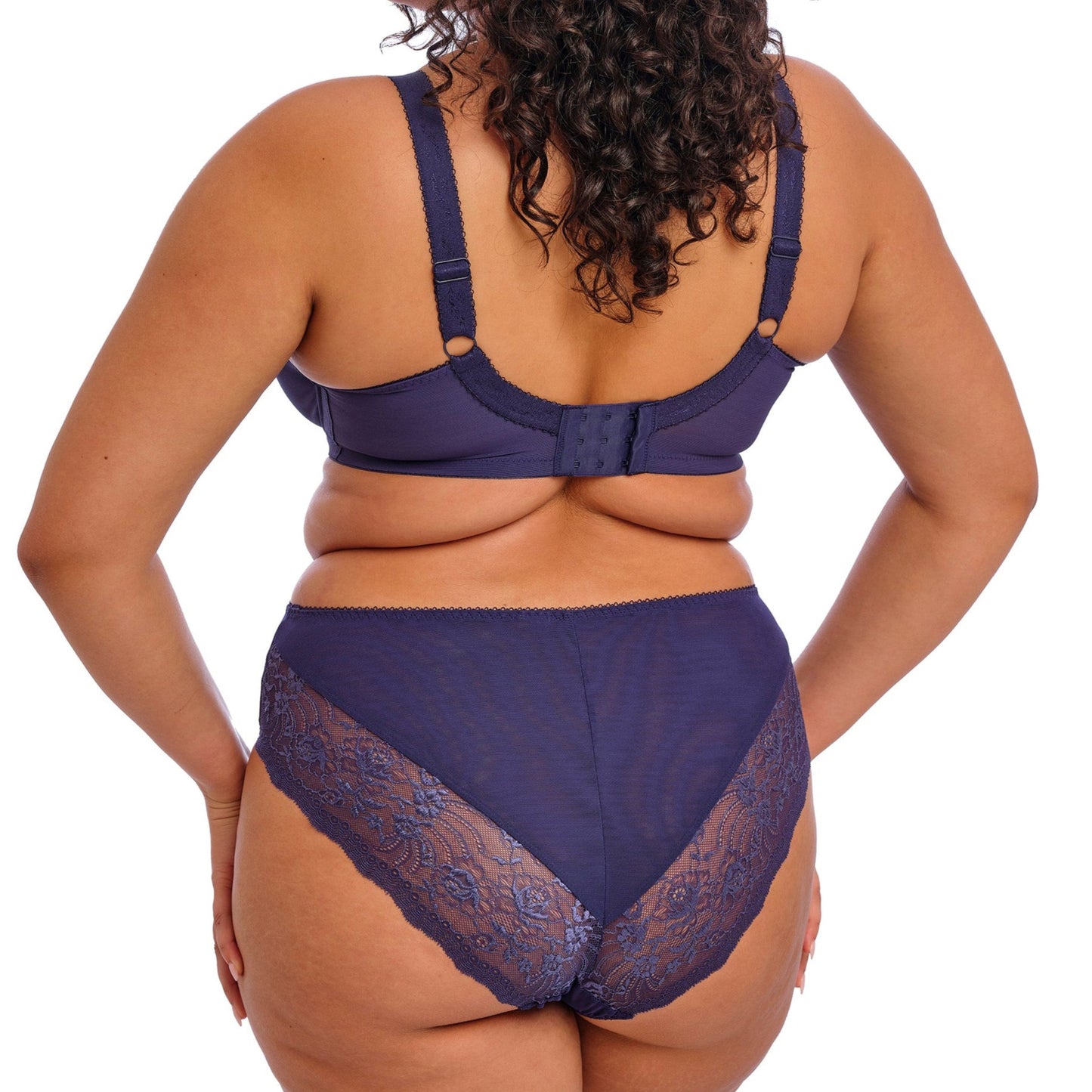 curvy woman wearing Midnight blue underwear with lace detailing on a white background