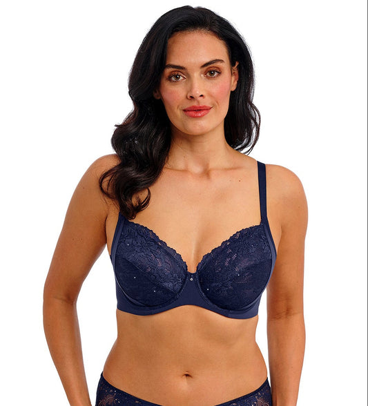 woman wearing a dark blue bra with mesh , lace details and strass accents