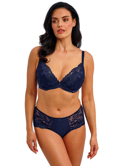 woman wearing a blue lace plunge bra with little strass details