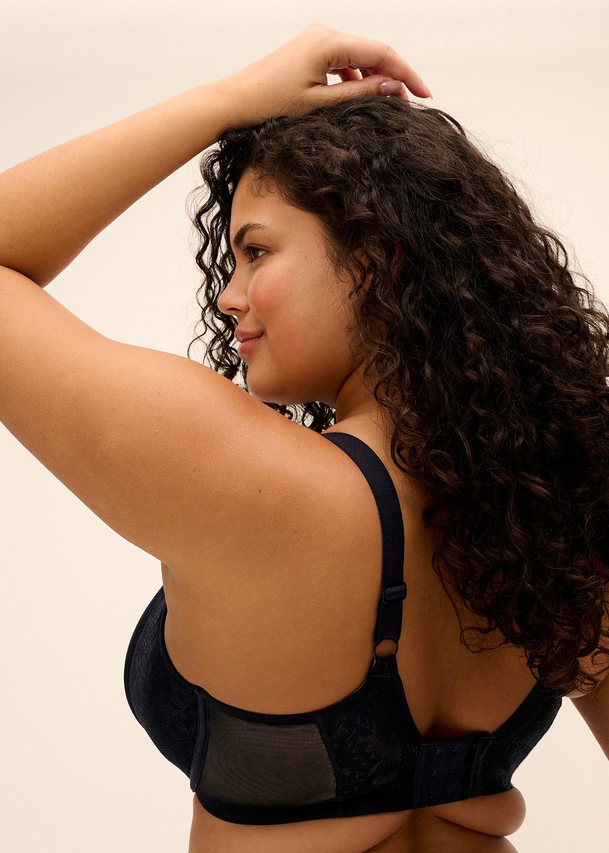 curvy woman wearing a black big cup moulded spacer bra