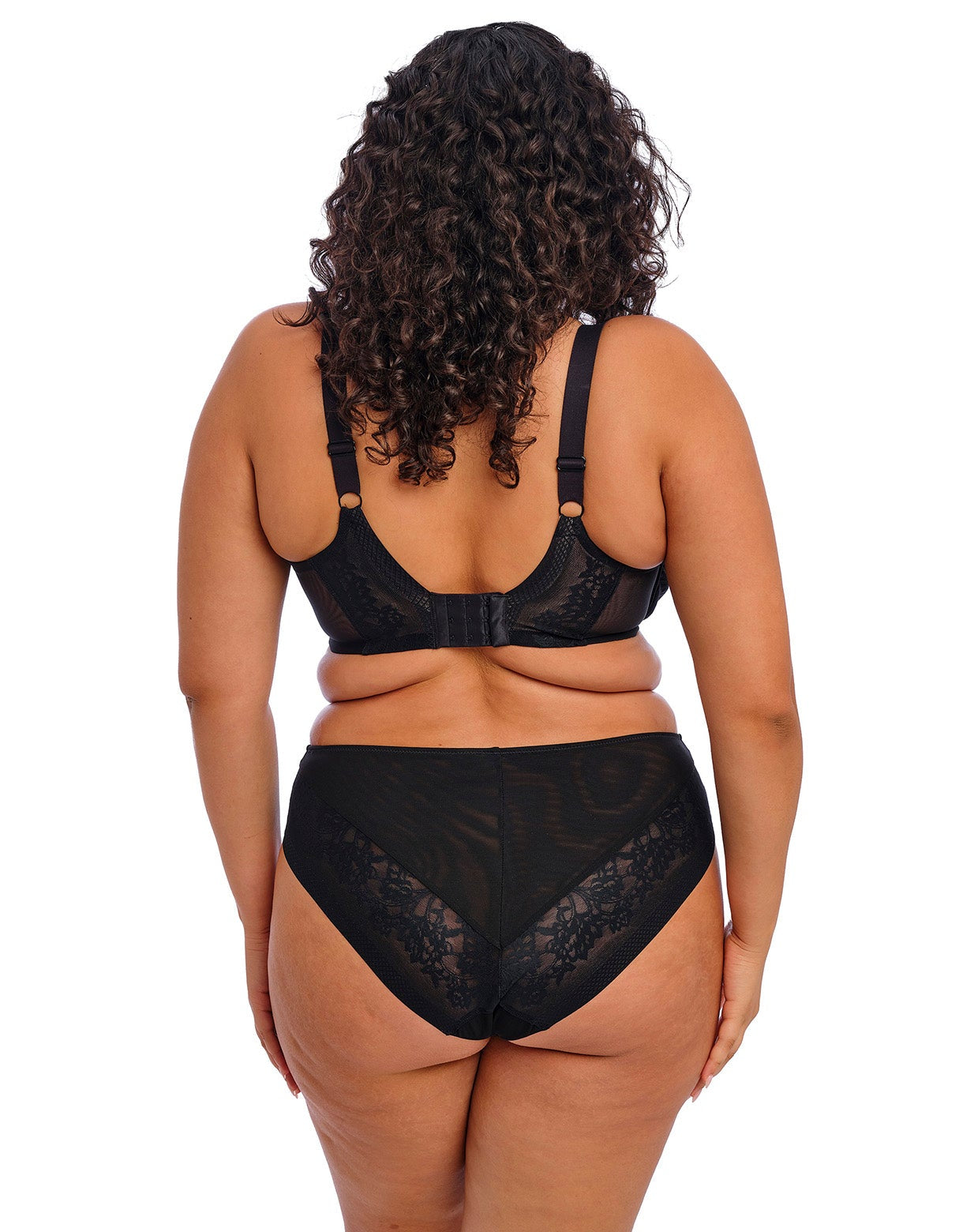 curvy woman wearing a black big cup moulded spacer bra with matching brief