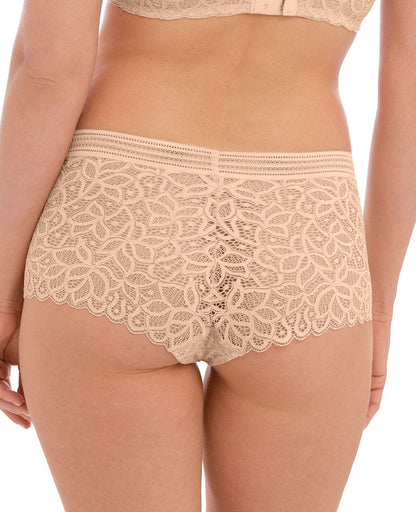 woman wearing lace lingerie shorts in nude color