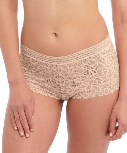 woman wearing lace lingerie shorts in nude color