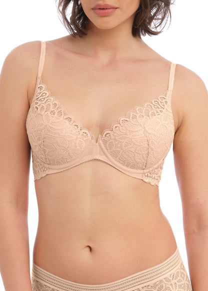 woman wearing a lace push up bra in nude color