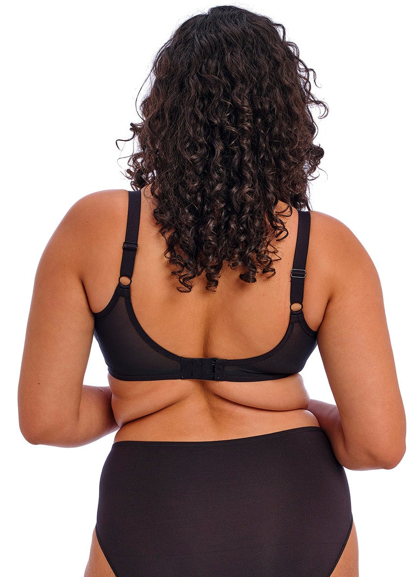 curvy woman wearing a Black bra for big cups on a white background