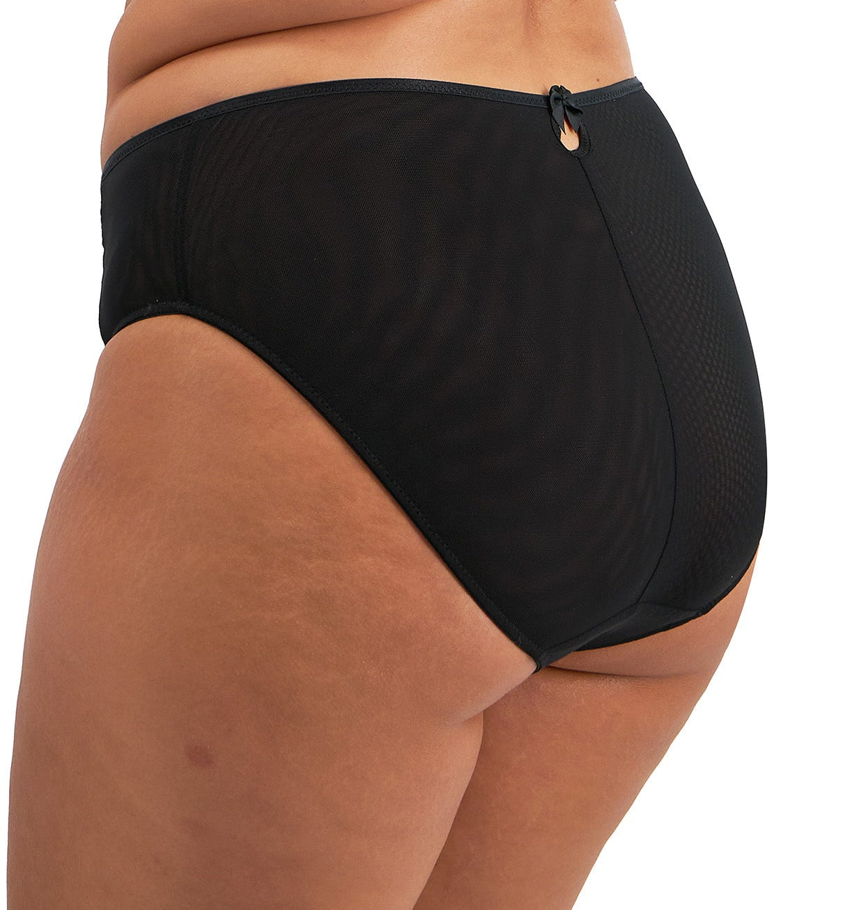 curvy woman wearing a plussize highwaist  highleg brief in black mesh with flower details in almond