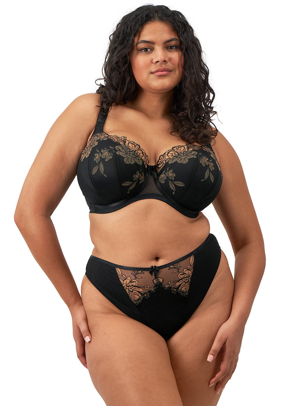 curvy woman wearing a black big cup padded bra with lace and embroidered flowers in almond colour