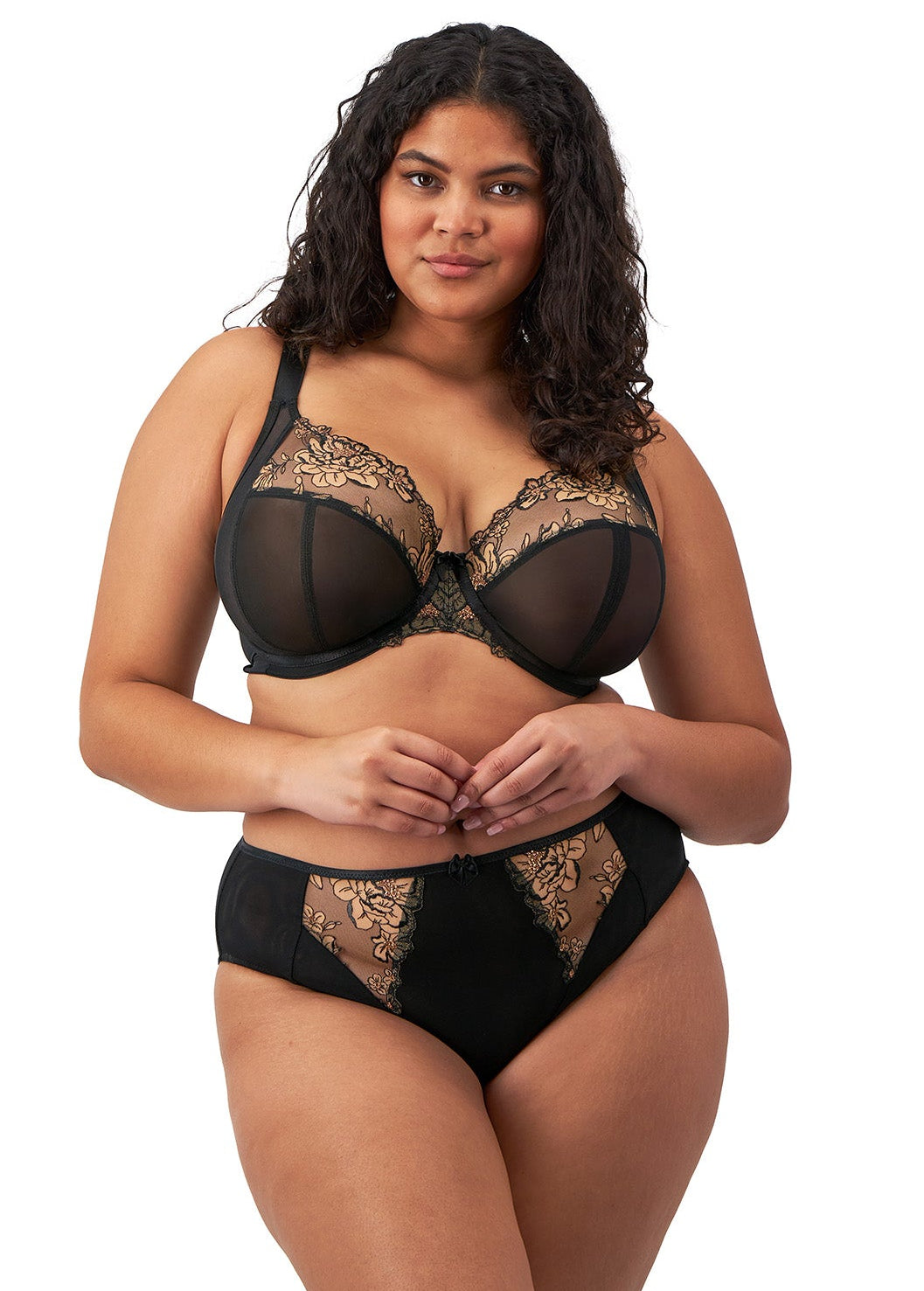 curvy woman wearing a black big cup plunge bra with lace and embroidered flowers in almond colour