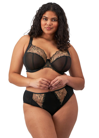 curvy woman wearing a black big cup plunge bra with lace and embroidered flowers in almond colour