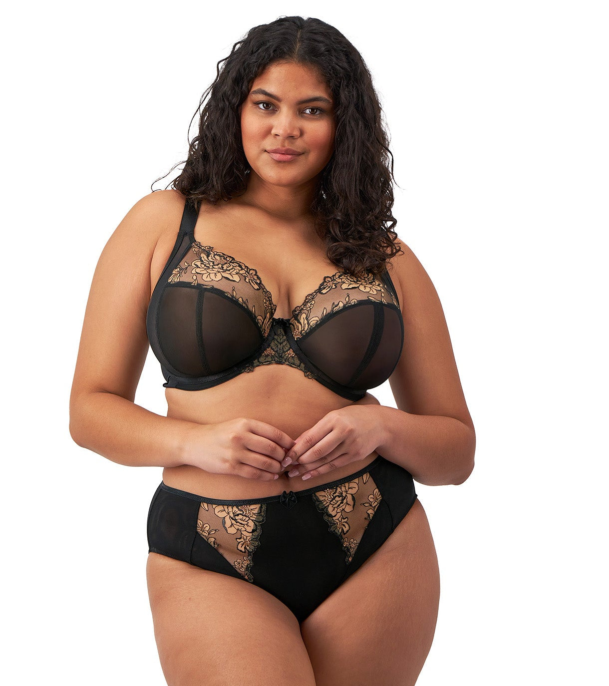 curvy woman wearing a plussize highwaist  highleg brief in black mesh with flower details in almond with matching bra