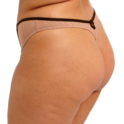 Beige thong with black lace detailing on a white background