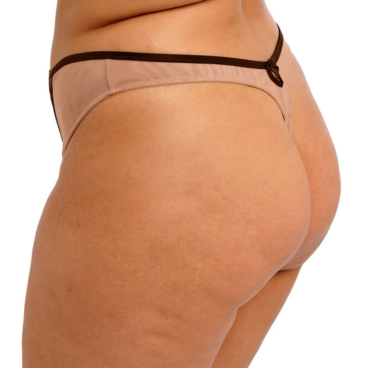 Beige thong with black lace detailing on a white background