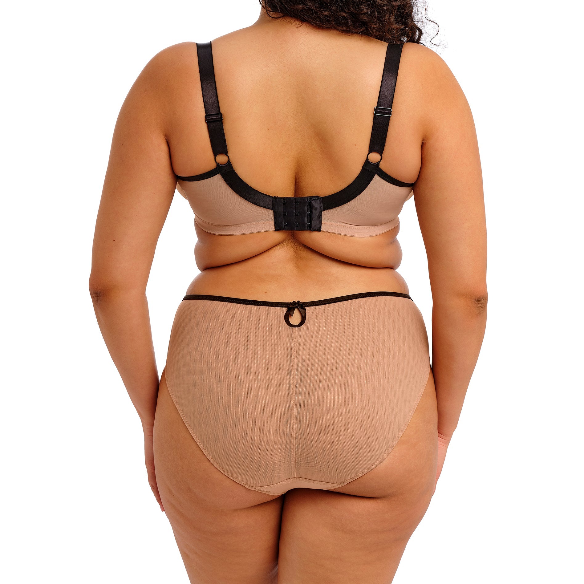 curvy woman wearing Beige underwear with black lace detailing on a white background