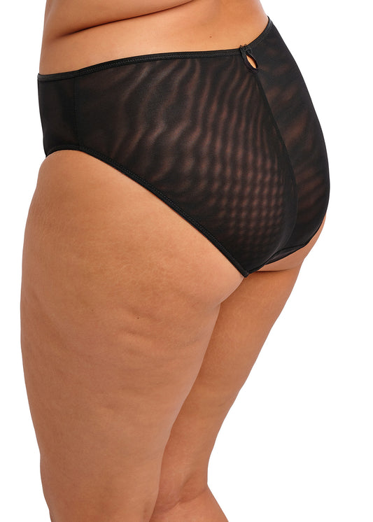 curvy woman wearing a black high leg brief with lace and embroidered flower details in summer colours