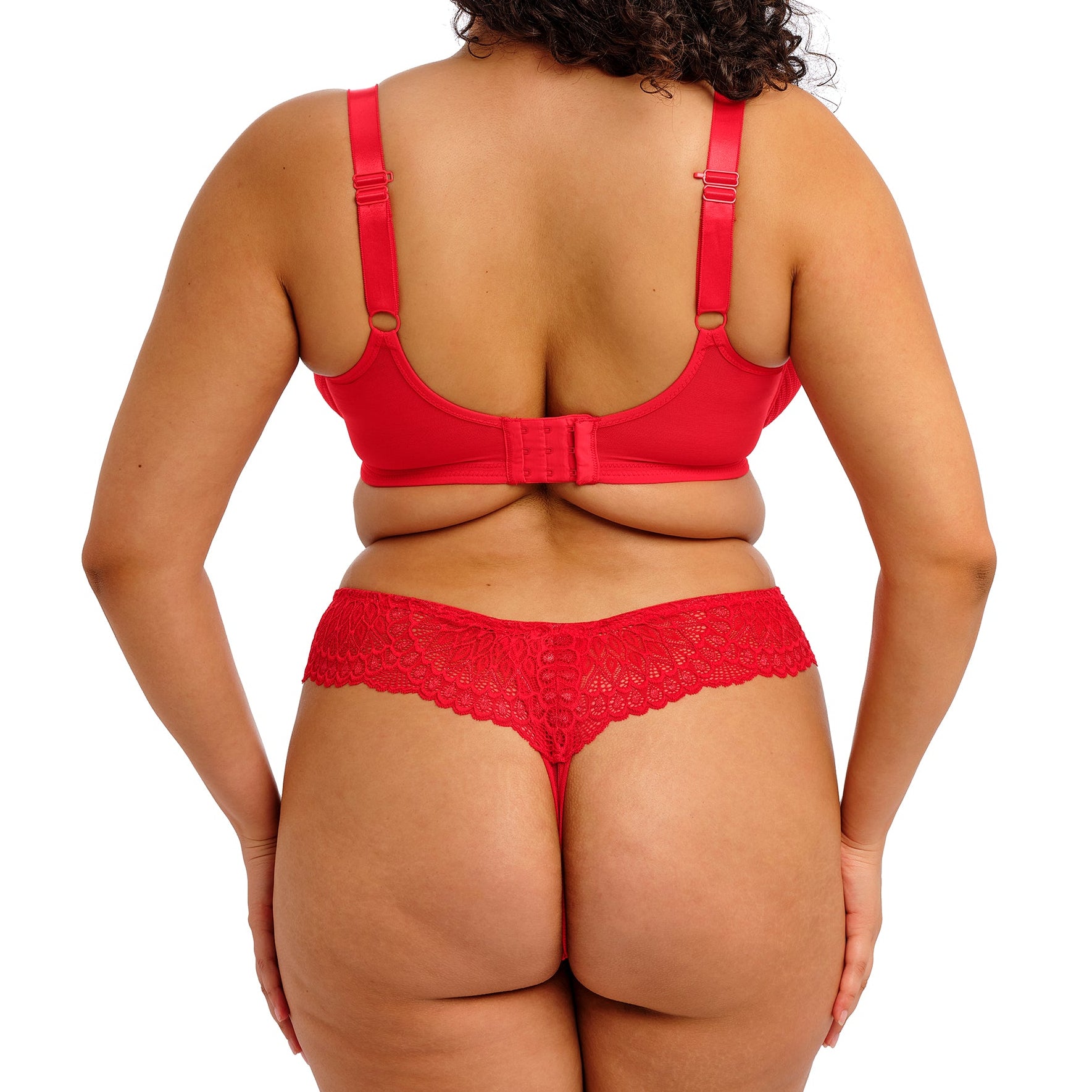 curvy woman wearing Red lace underwear on a white background