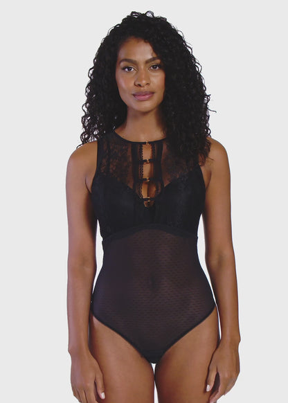 woman wearing a black bodysuit with mesh and lace