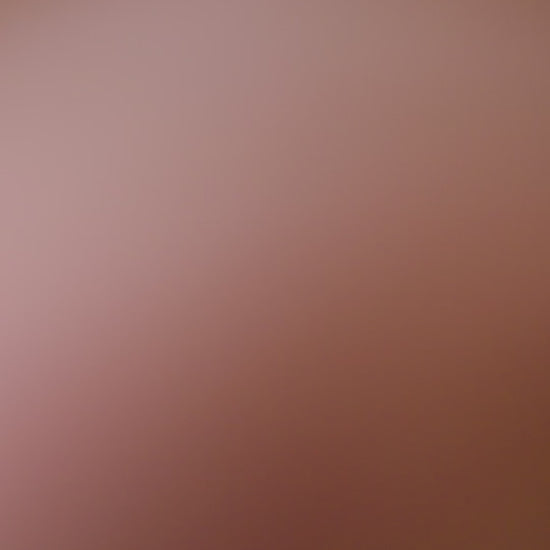 curvy woman wearing a purple lingerie set on a white background