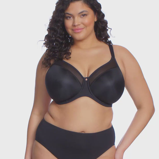 curvy woman wearing Black bra and high-waisted lingerie bottom on a white background