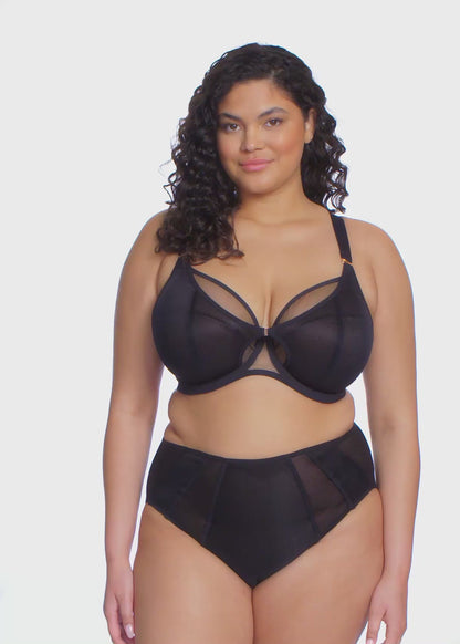 curvy woman wearing a black big cup bra in mesh with matching brief