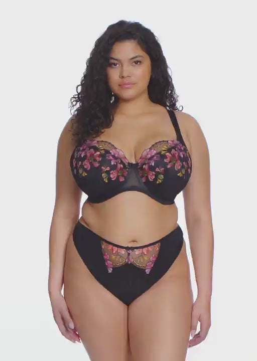 curvy woman wearing a black padded big cup bra with lace and embroidered flowers in summer colours
