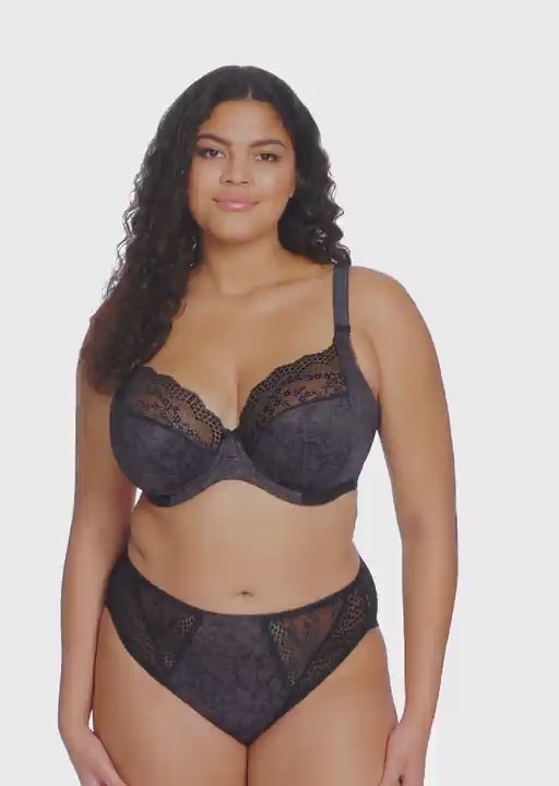 curvy woman wearing Black lace underwear with leopard print trim on a white background