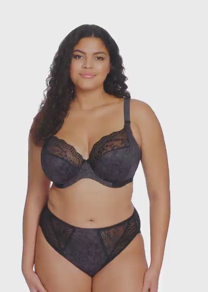 curvy woman wearing Black lace underwear with leopard print trim on a white background