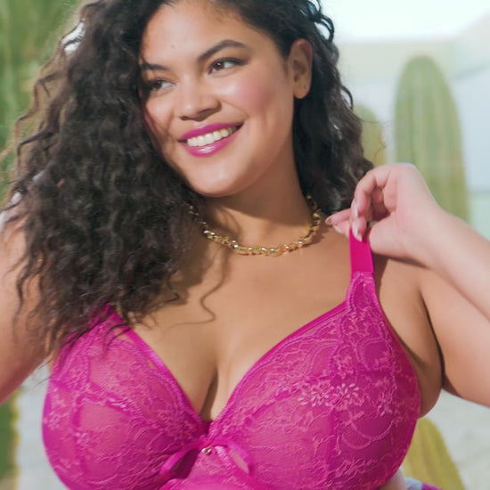curvy woman wearing a azalea pink underwired plussize plunge bra 