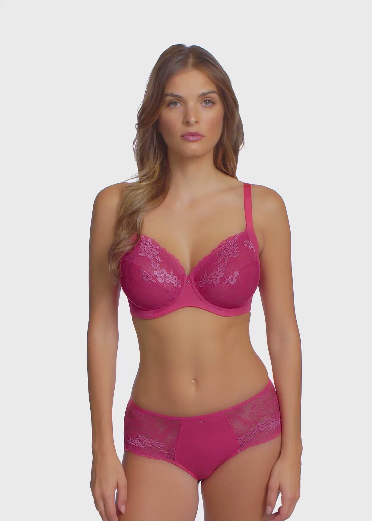 woman wearing a geranium pink short with embroidered soft pink flowers 